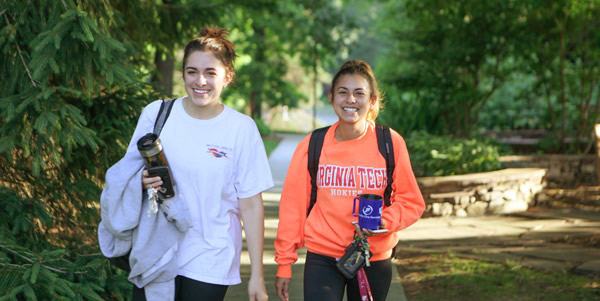 Graphic of student walking on campus in the morning.
