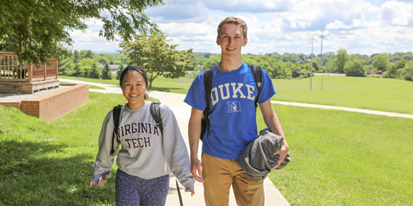 Graphic of Students Walking down a side walk
